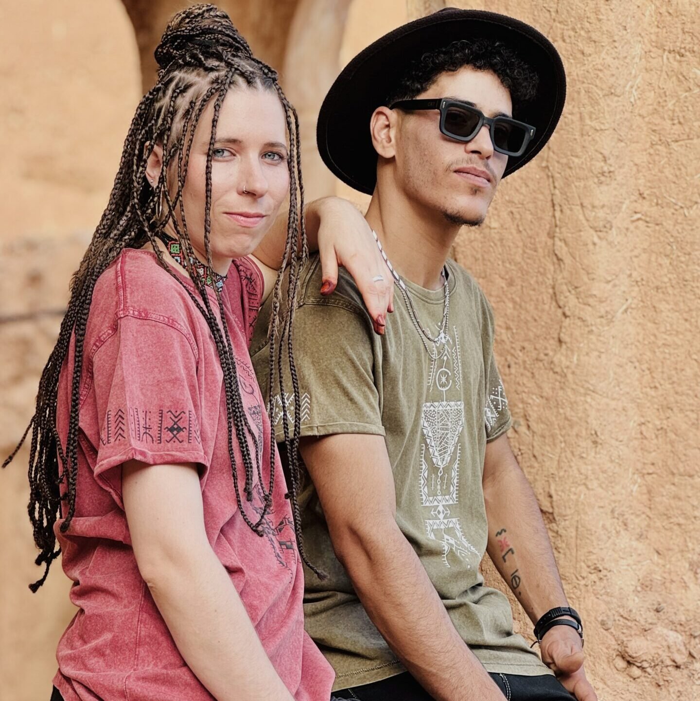 Olive and pink Moroccan heritage T-shirts featuring distinctive cultural-inspired graphic designs