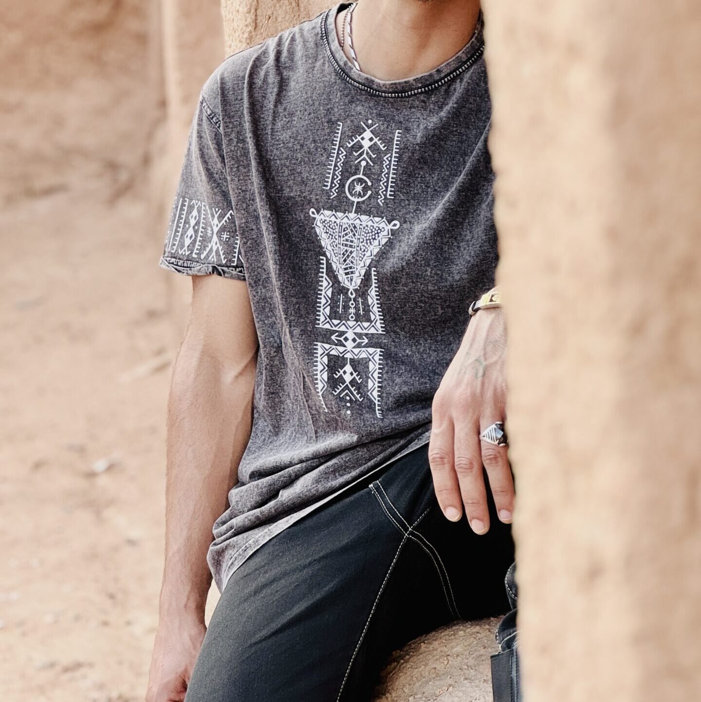 Black Moroccan heritage-inspired T-shirt featuring a distinctive cultural graphic design