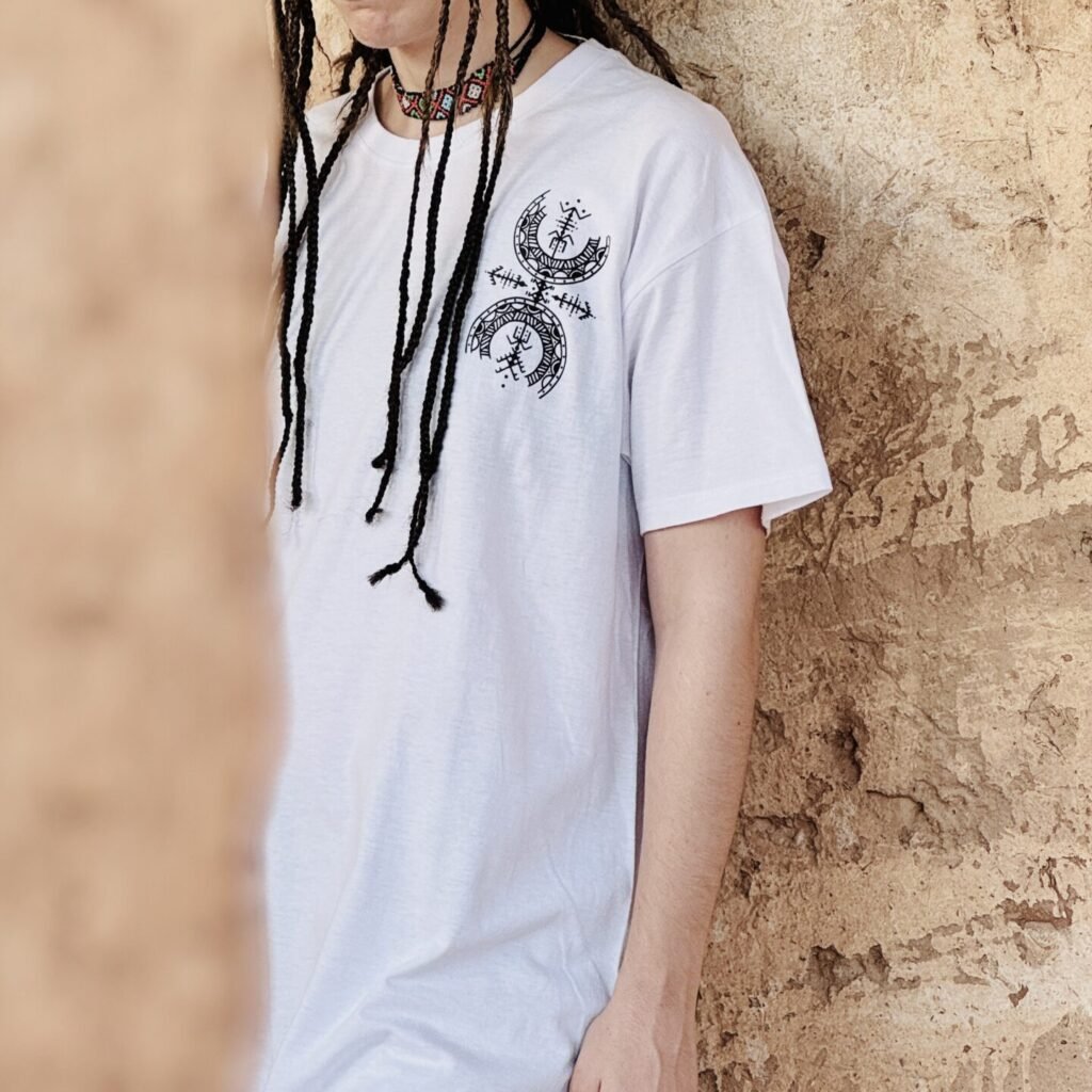 White Amazigh T-shirt featuring a distinctive heritage-inspired graphic design