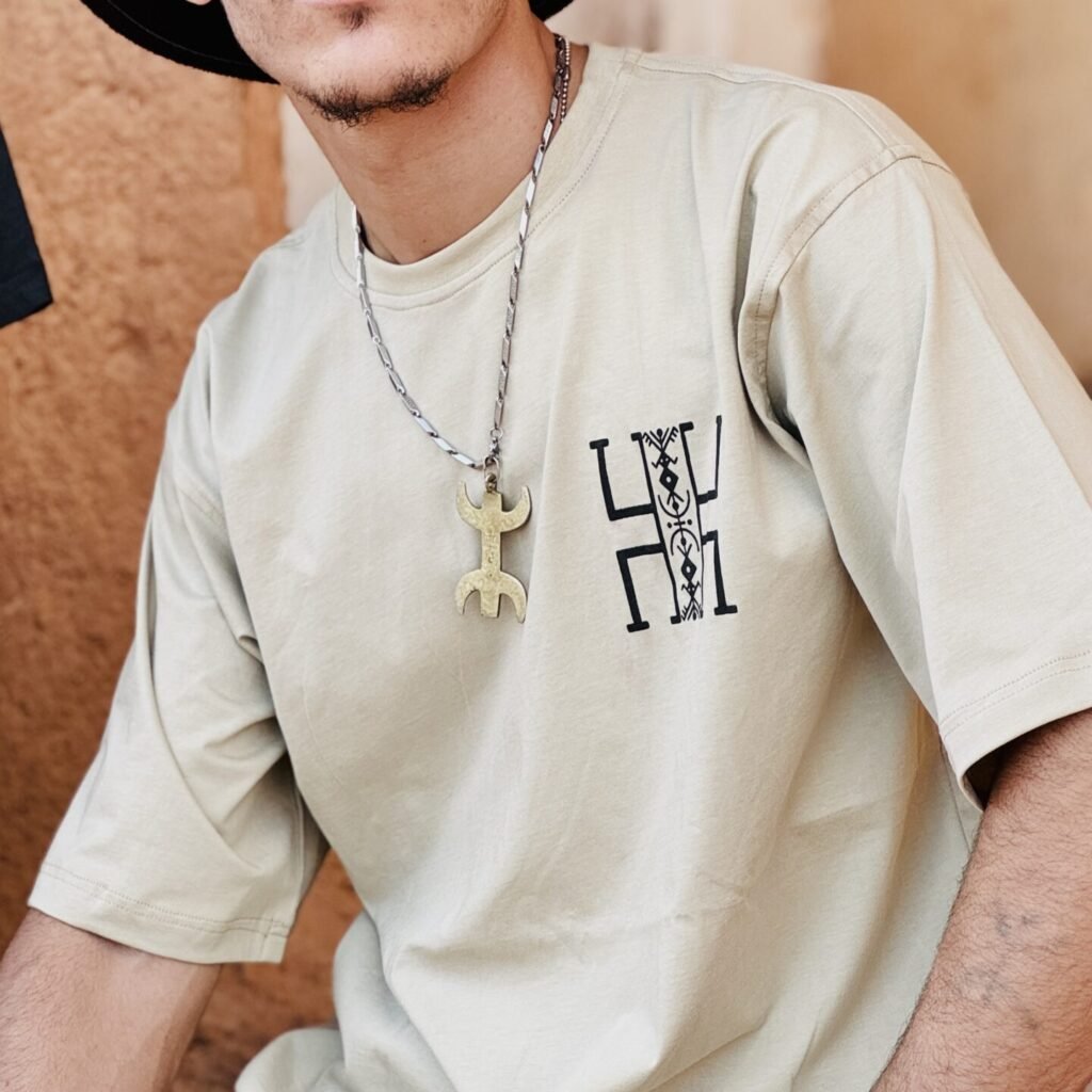 Beige Amazigh T-shirt with a distinctive heritage-inspired graphic design