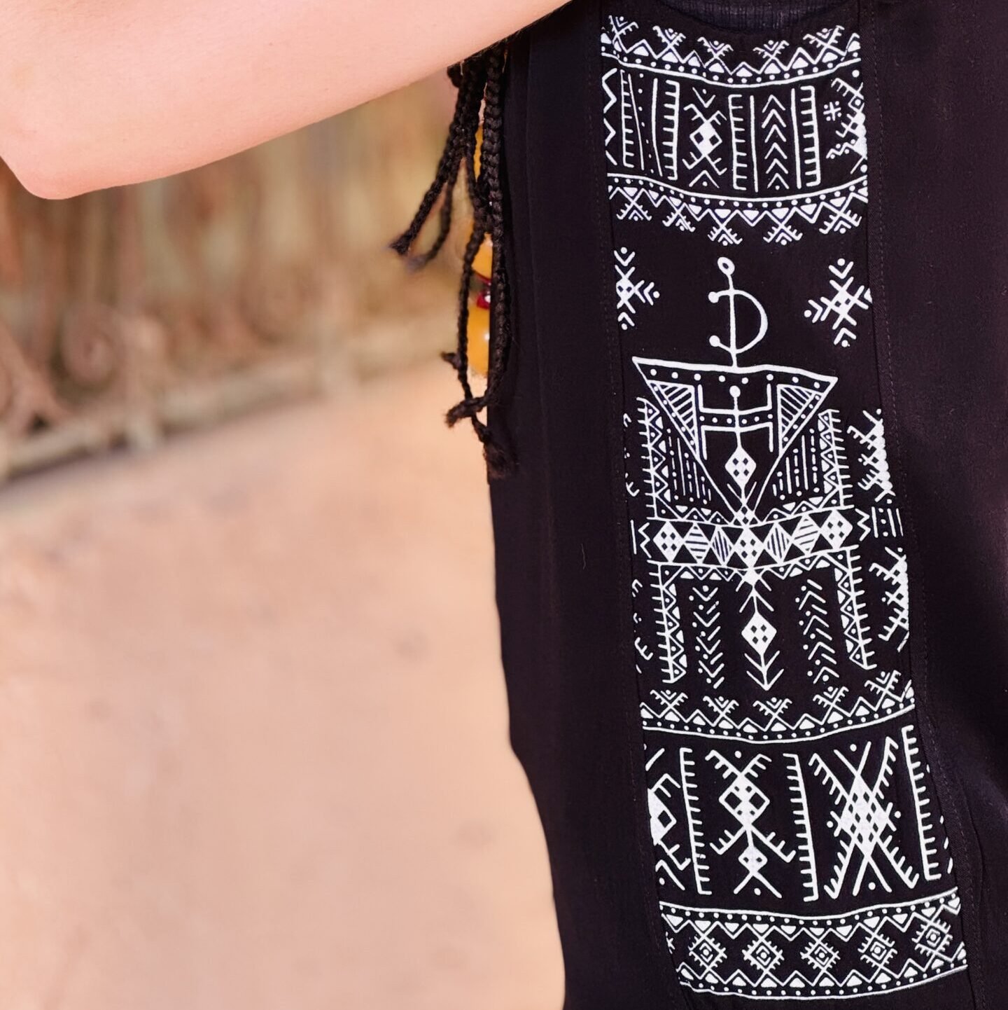 Black sleeveless Amazigh top with detailed white geometric side panel