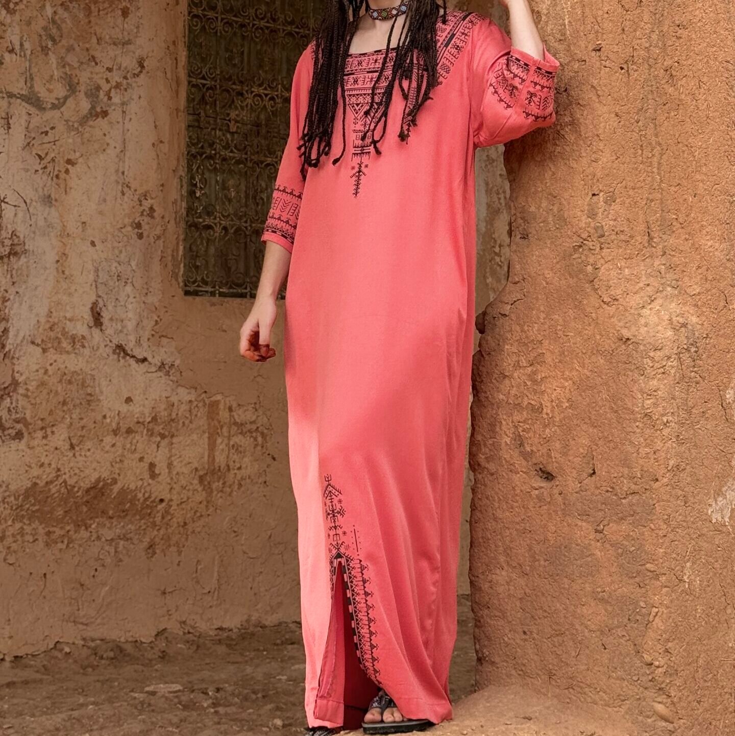 Pink robe featuring bold black Amazigh geometric embroidery