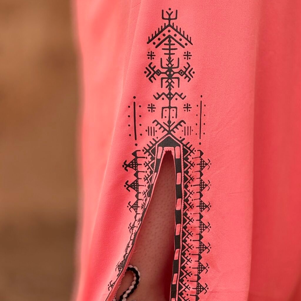Pink Amazigh robe with geometric design along the lower hem