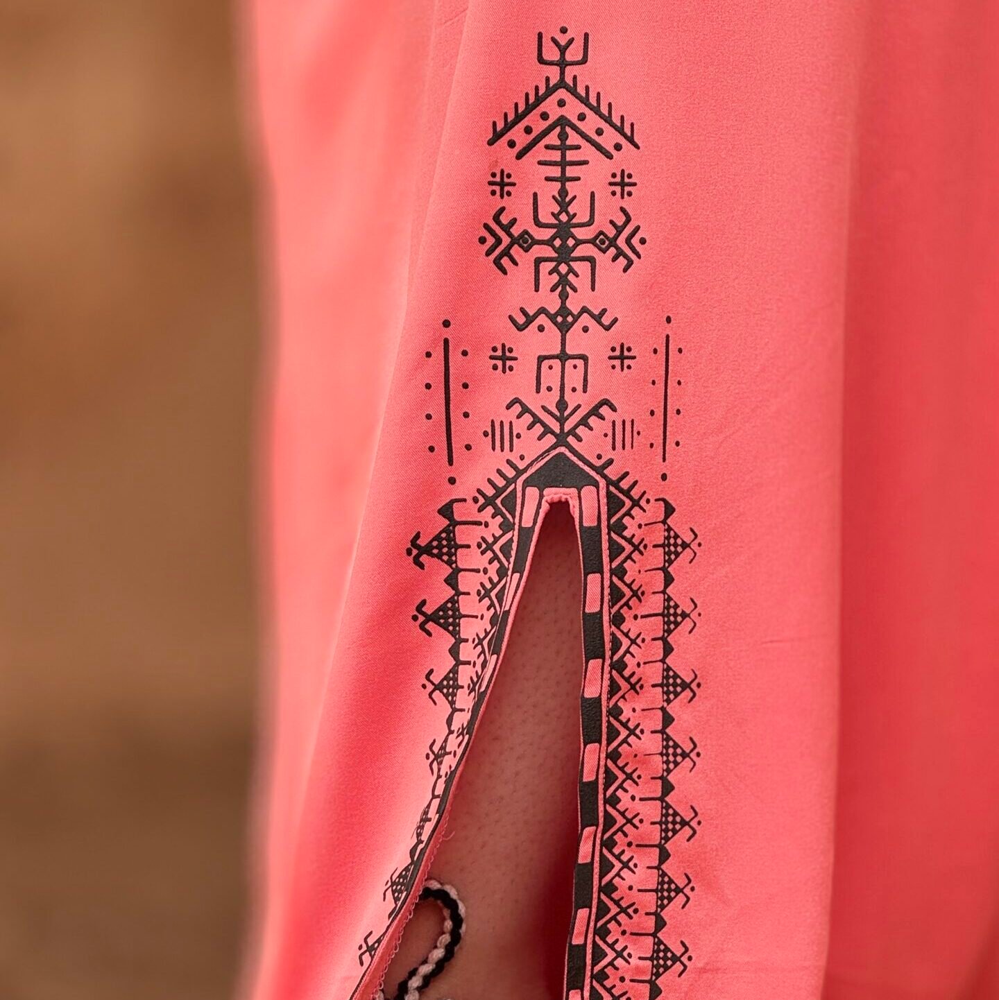 Pink Amazigh robe with geometric design along the lower hem
