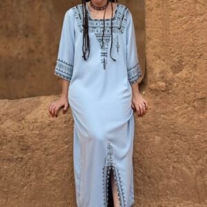 Light blue Moroccan Amazigh dress with black geometric embroidery and traditional patterns