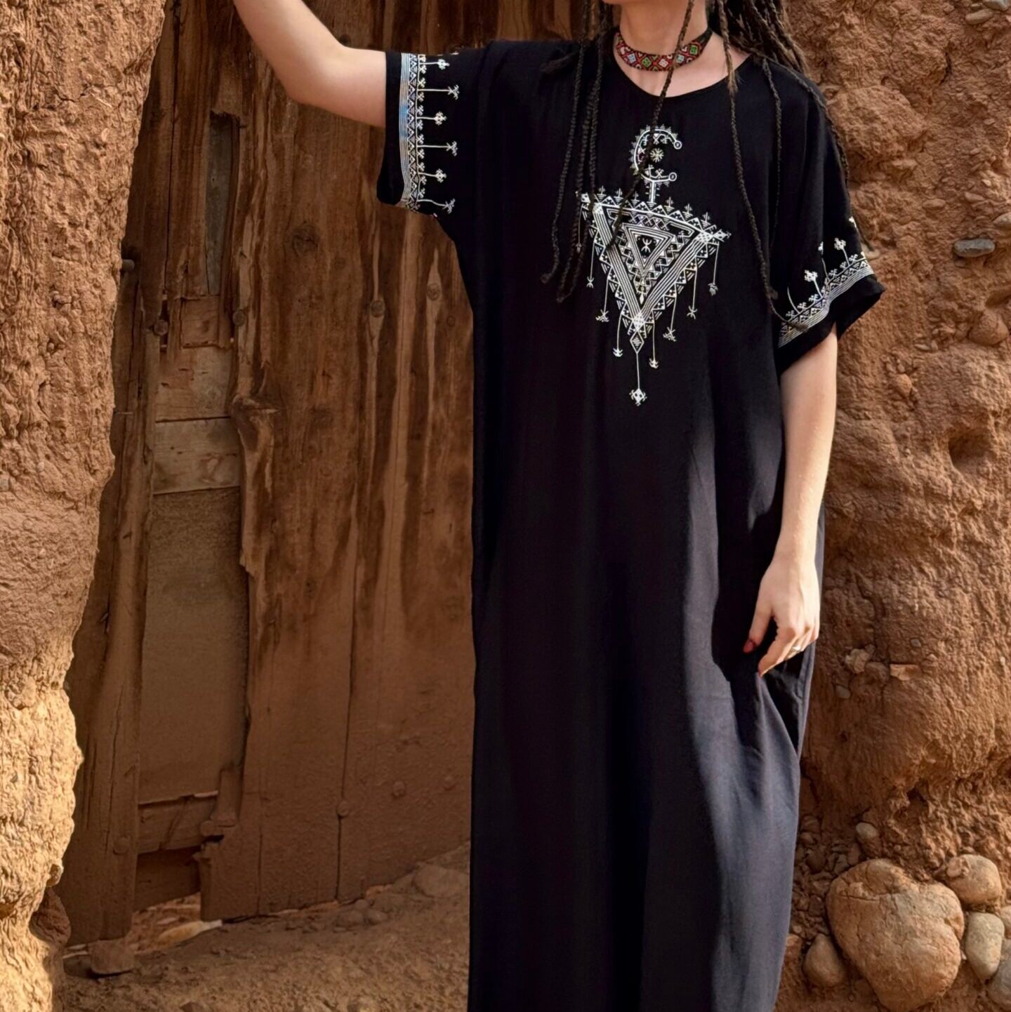 Black Moroccan Amazigh dress with Tasghonst symbol and silver geometric embroidery