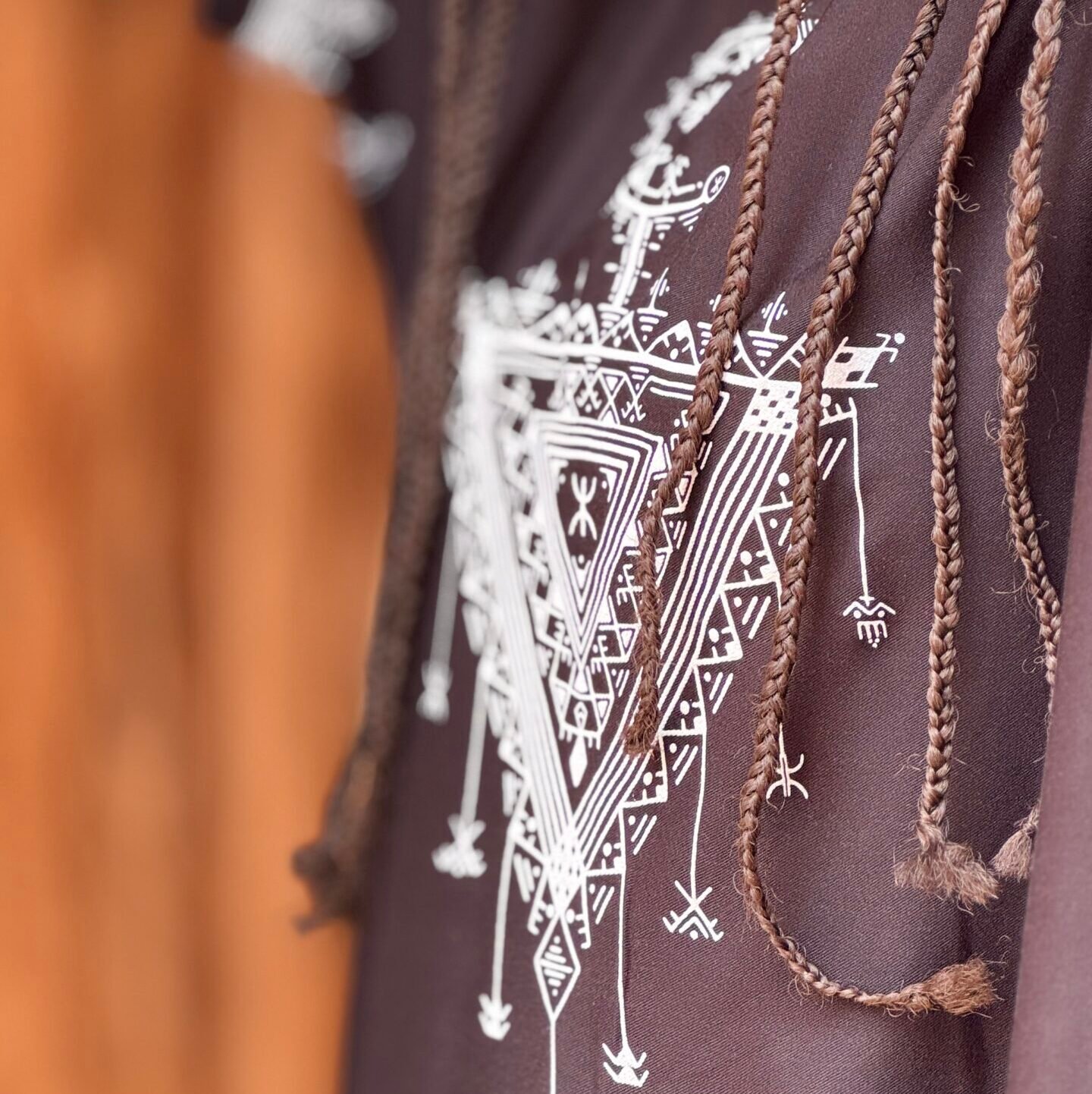 Black Moroccan Amazigh dress with colorful Tasghonst symbol and traditional geometric embroidery