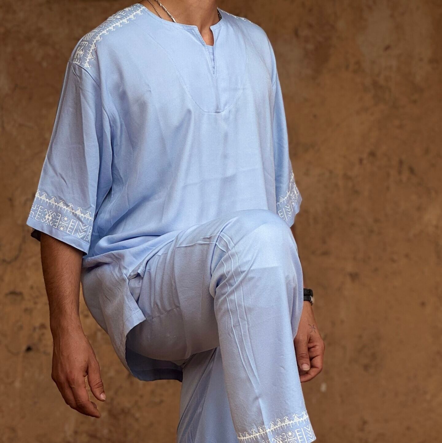 Light blue Moroccan Amazigh outfit for men with white geometric embroidery