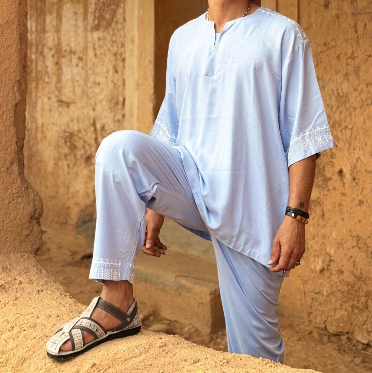 Light blue Moroccan Amazigh men’s outfit with white geometric embroidery