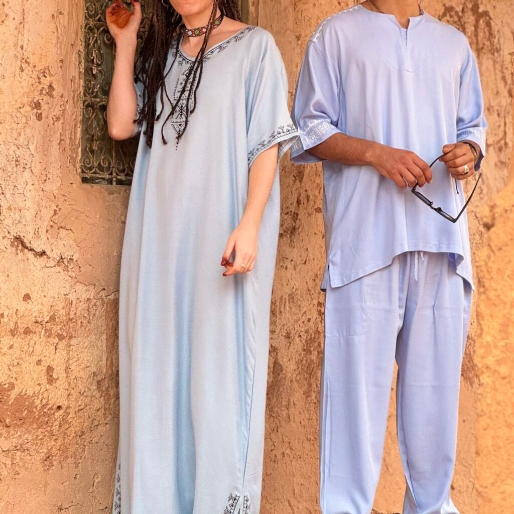 Light blue Moroccan outfits for women and men with white decorative embroidery