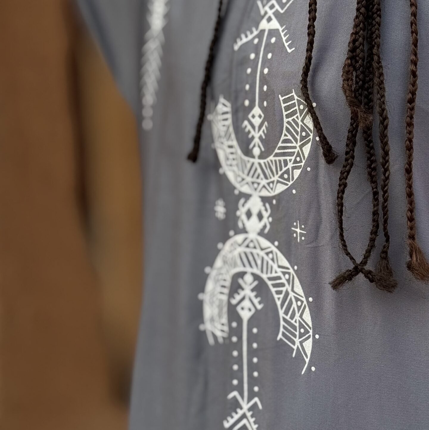 Gray Moroccan Amazigh tunic with white traditional geometric symbols and decorative motifs