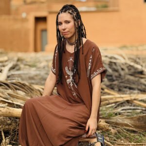 Brown Amazigh dress featuring black AZA symbols and geometric decorative patterns