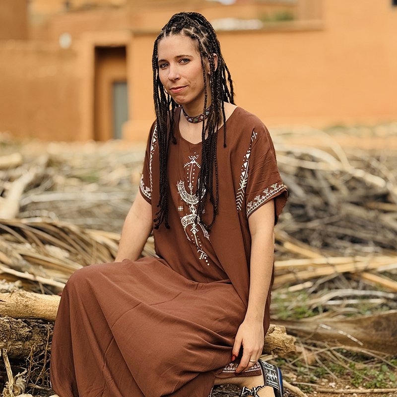 Brown Amazigh dress featuring black AZA symbols and geometric decorative patterns