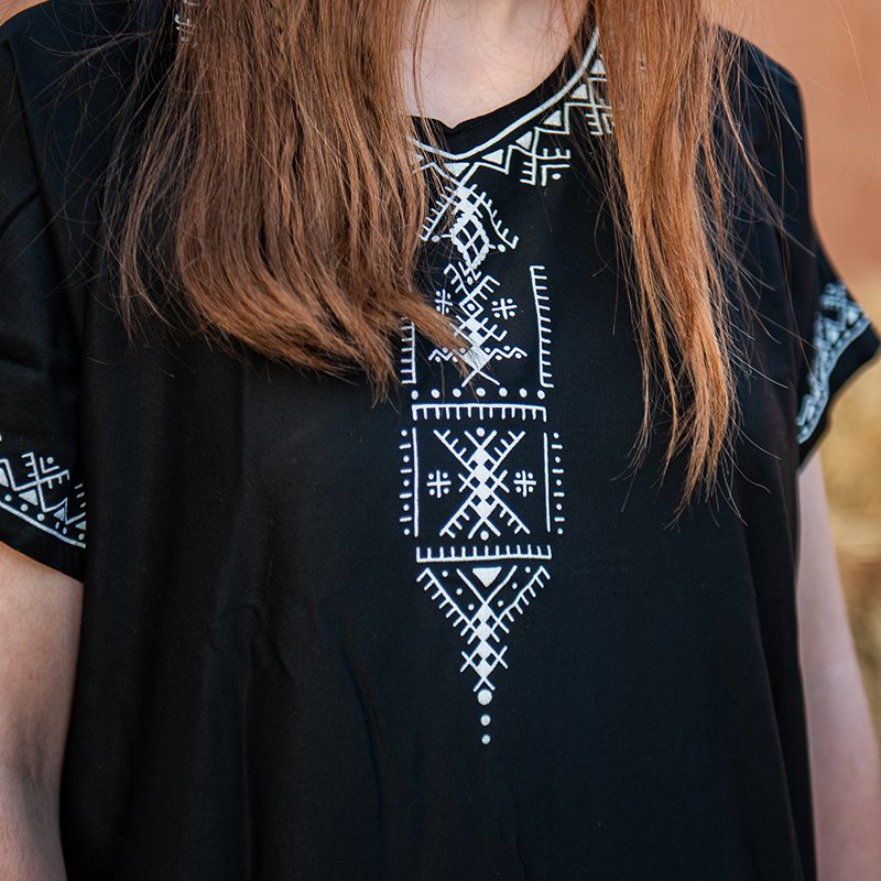 Black Amazigh gandora with white geometric traditional patterns