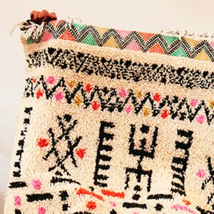 Amazigh Moroccan rug featuring traditional geometric woven patterns