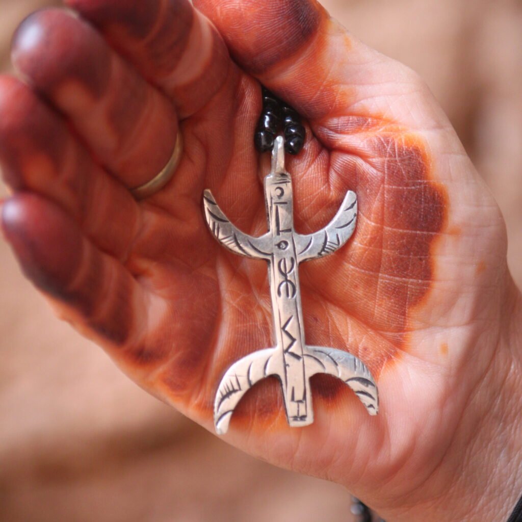 Amazigh silver pendant with engraved Berber symbols and traditional Moroccan design