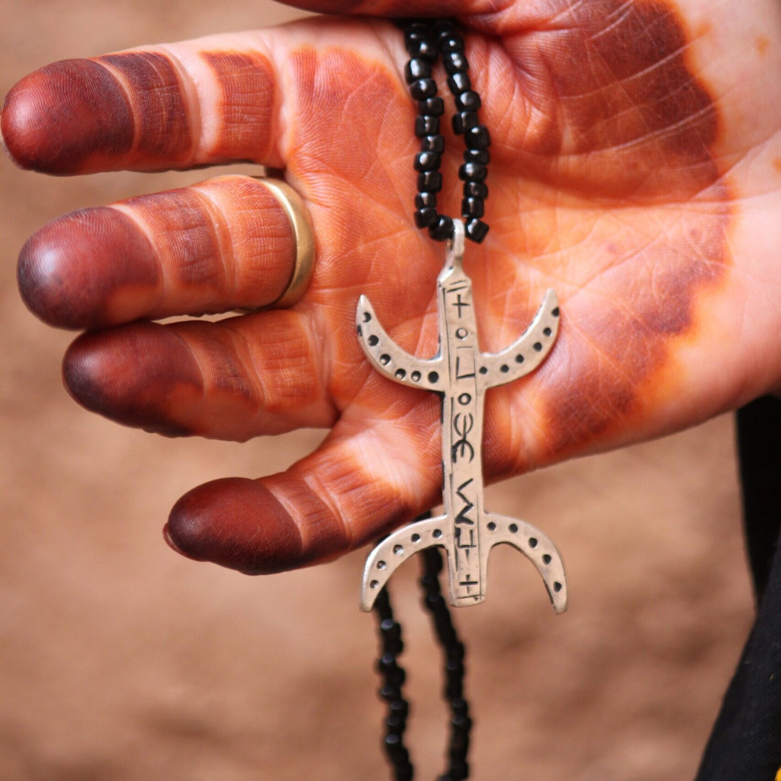 Amazigh silver jewelry piece with traditional Berber symbols and Moroccan handcrafted design