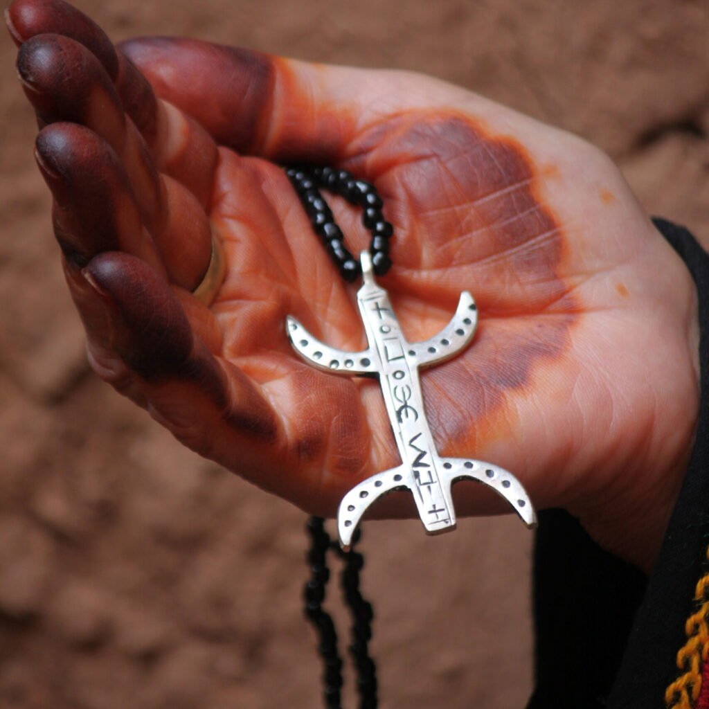 Amazigh silver pendant necklace with geometric Berber motifs and traditional Moroccan jewelry design