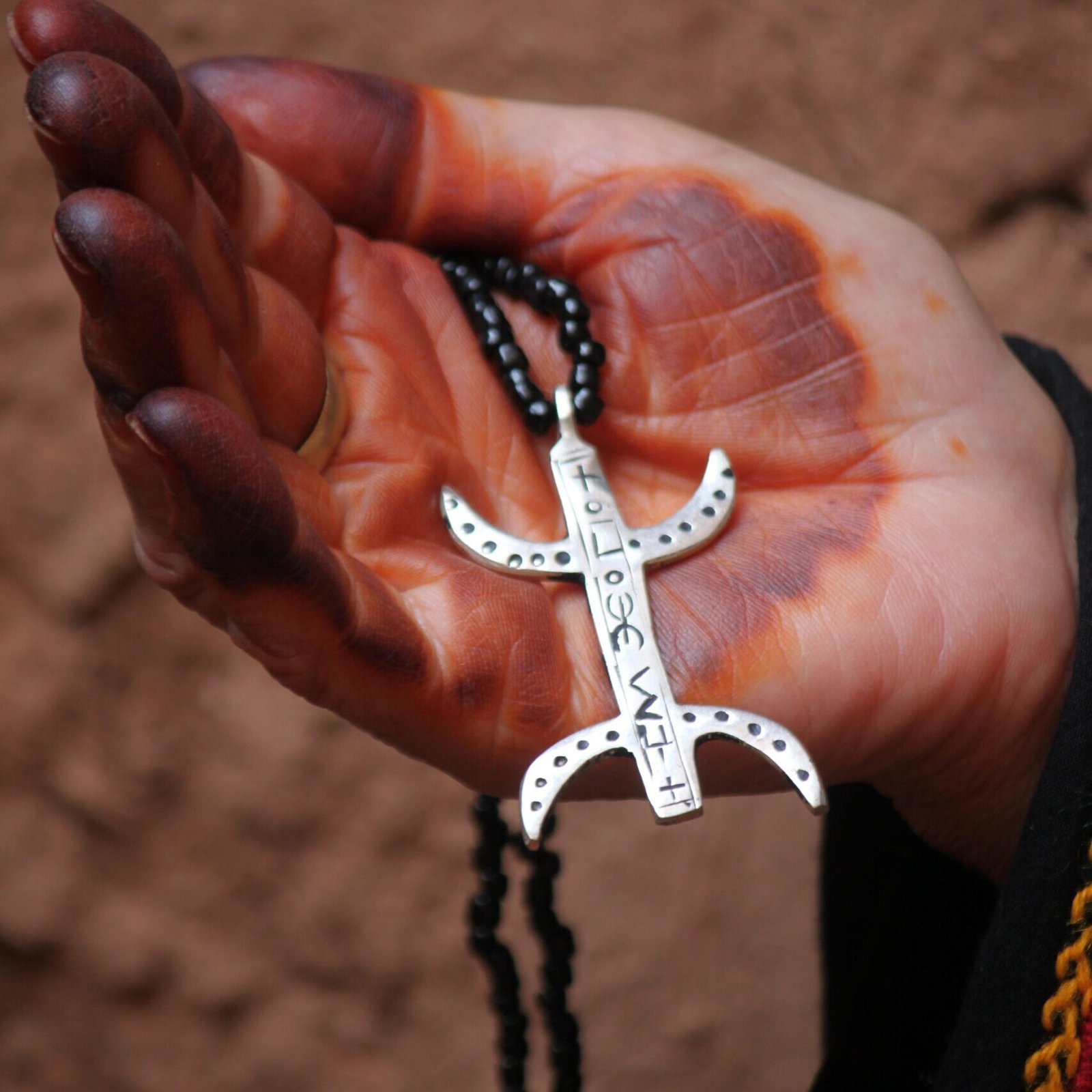 Amazigh silver pendant necklace with geometric Berber motifs and traditional Moroccan jewelry design